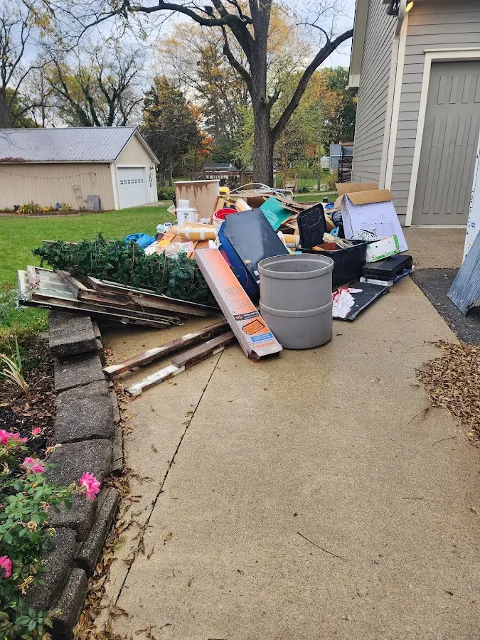 Dumpster being loaded with debris for 3 Yard Dumpster Rental in Sandy Creek